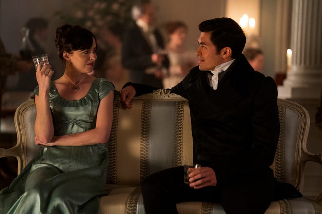 Anne (Dakota Johnson) is wooed by the mysterious Mr. Elliot (Henry Golding) in "Persuasion."