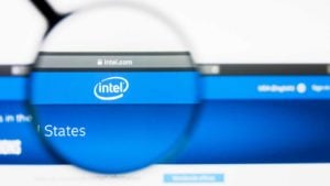 a magnifying glass enlarges the Intel logo on the company website