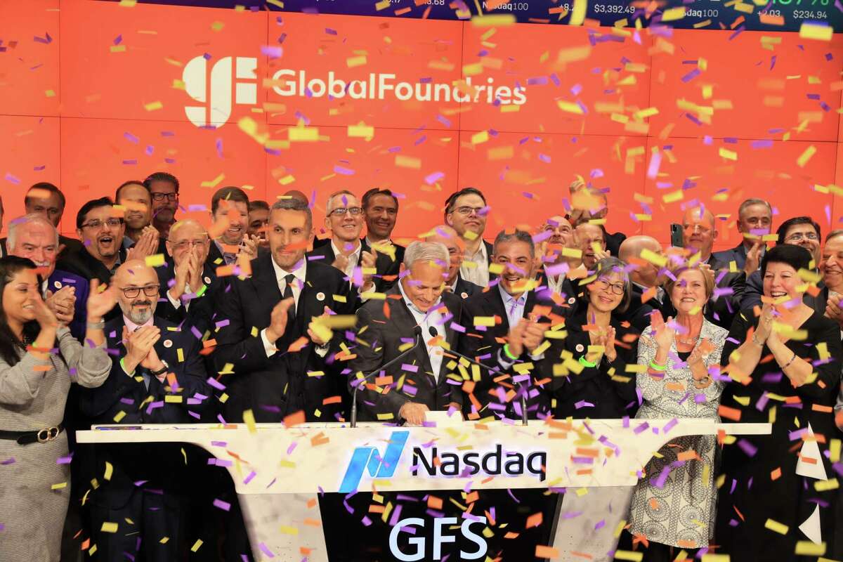 GlobalFoundries CEO Tom Caulfield, front center, celebrates with employees, board members and investors at the company's $3 billion IPO last year at the Nasdaq stock market in New York City.