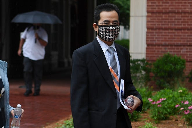 Professor Anming Hu enters the Howard H. Baker Jr. United States Courthouse in Knoxville in 2021. A judge acquitted him.