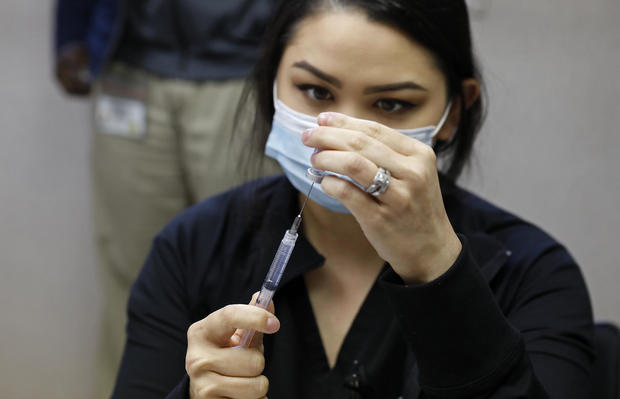 The city of Vernon demonstrates the use of special refrigeration to store Pfizer COVID-19 vaccine as they city is using a van to operate a mobile clinic and provide vaccination to frontline workers at various food and industrial plants in the city.