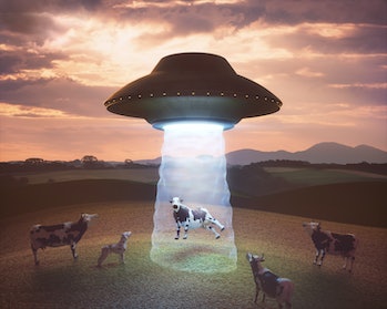 Conceptual illustration of alien abduction. Unidentified flying object (UFO) lifting a car.