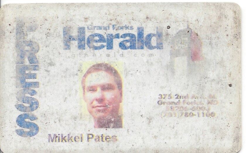 A press pass and entry pass to the Grand Forks Herald in about 2000`